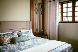 Ένα ή περισσότερα κρεβάτια σε δωμάτιο στο Casa de Campo Vienna - Pouso Alegre - MG +23 φωτογραφίες