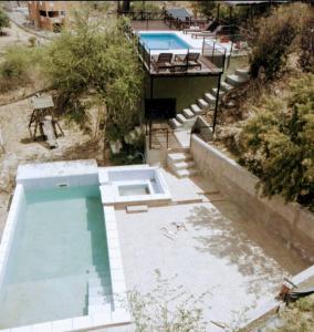 Πισίνα στο ή κοντά στο Cabañas La Puesta del Sol