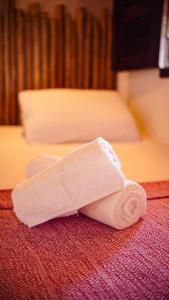 Ένα ή περισσότερα κρεβάτια σε δωμάτιο στο Casa Camboa Barrinha de baixo, Praia do Preá