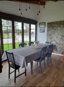 a dining room with a large table and chairs at Rural Norte in Bañugues