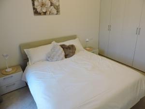 Ένα ή περισσότερα κρεβάτια σε δωμάτιο στο L'Ora del Bianco