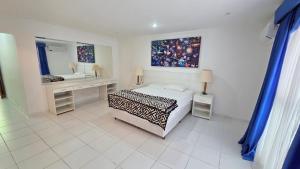 Giường trong phòng chung tại Cobertura 5 quartos sendo 4 suites , piscina churrasqueira , Pitangueiras , 4 vagas +51 ảnh