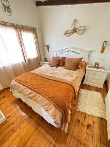 En eller flere senge i et værelse på Casa General Belgrano