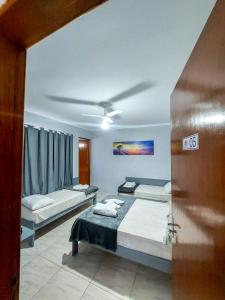 Ένα ή περισσότερα κρεβάτια σε δωμάτιο στο Pousada Parada Da Fe1