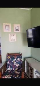 Et tv og/eller underholdning på Casa Kaly pé na areia