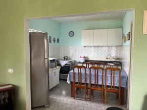 Køkken eller tekøkken på Casa Kaly pé na areia