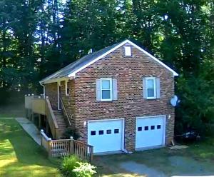 a house with two white garage doors at Wildwood Estates in Lynchburg