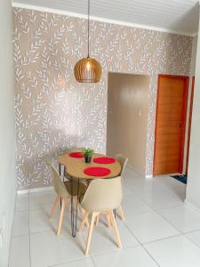 a dining room with a table and chairs at Casa de Condomínio, Área de Lazer, Home Office in Castanhal