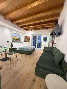 a living room with a couch and a table at Caminneci Palace Boutique in Palermo