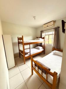 Ένα ή περισσότερα κρεβάτια σε δωμάτιο στο Hotel Pousada Pereira