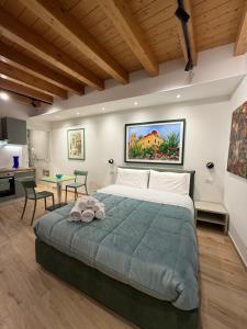 a bedroom with a large bed and a table at Caminneci Palace Boutique in Palermo