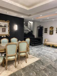 a dining room with a table and chairs at Twin villa for rent in madinaty in Madinaty