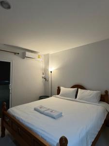 Ένα ή περισσότερα κρεβάτια σε δωμάτιο στο W Smart Stay TRANG