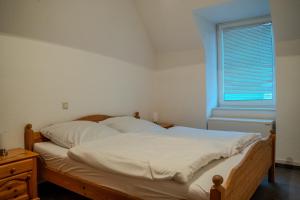 Ένα ή περισσότερα κρεβάτια σε δωμάτιο στο Mosella FeWo