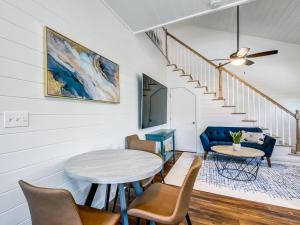 a living room with a table and chairs at Beachside Villa Unit 4 in Tybee Island