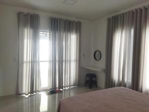 Ένα ή περισσότερα κρεβάτια σε δωμάτιο στο Refúgio do Mar +15 φωτογραφίες