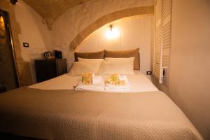 Ένα ή περισσότερα κρεβάτια σε δωμάτιο στο Suite Pietra Bianca - Relax & SPA