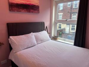 Postel nebo postele na pokoji v ubytování The Bluebird B&B II