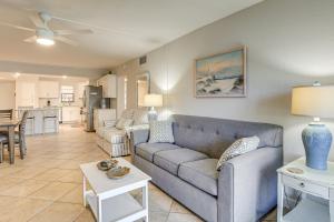a living room with a couch and a table at Bayfront South Pasadena Condo with Resort Perks in St Pete Beach