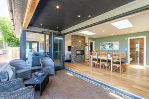 a dining room and living room with a table and chairs at lakeside Lodge in Bristol