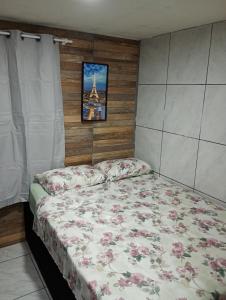 Кровать или кровати в номере Aconchego