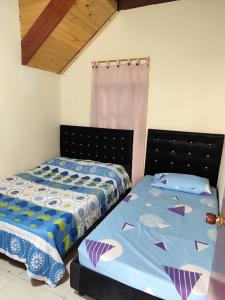 Кровать или кровати в номере Glamping y Cabañas SPLENDOR VILLA EL EDEN