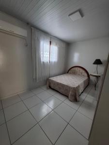 Ένα ή περισσότερα κρεβάτια σε δωμάτιο στο Apartamento completo