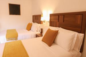 Ένα ή περισσότερα κρεβάτια σε δωμάτιο στο Hotel Casa KARLOTTA