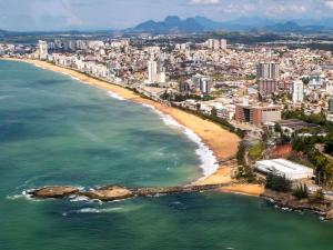 an aerial view of a beach and a city at Ibis Styles Macaé in Macaé