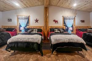 a bedroom with two beds in a room at Spacious Hurley Home with Game Room Near Lakes in Hurley