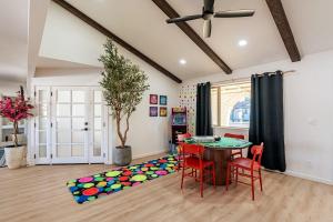 a living room with a table and chairs and a rug at Ella Oasis Heated Pool Hot Tub Near Old Town in Scottsdale