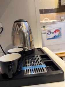 a coffee pot sitting on top of a counter at شقة الفخامة in Medina