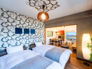 Кровать или кровати в номере MY STORY Familia 801-無料駐車場