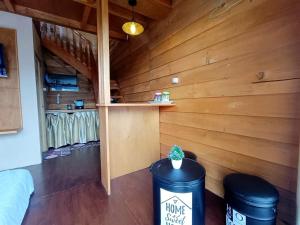 a room with two trash cans in a cabin at Dieng Indah Villa & Cabin by Hello Room in Dieng