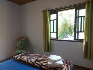 Giường trong phòng chung tại São João da Colina Ranch itamonte MG