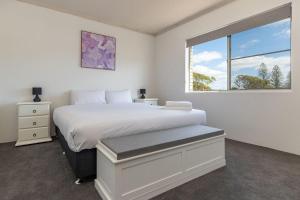 Ένα ή περισσότερα κρεβάτια σε δωμάτιο στο Anchorage 33