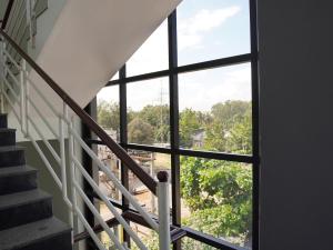 a view from the stairs of a house with a window at Hotel Janani Mansion in Mysore