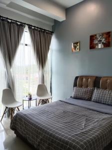 Postel nebo postele na pokoji v ubytování Armada Sweet Homestay