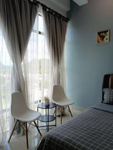 Postel nebo postele na pokoji v ubytování Armada Sweet Homestay