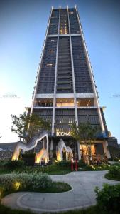 a tall building with a lion statue in front of it at HomeStay ICON40 HẠLONG in Ha Long