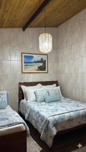 Voodi või voodid majutusasutuse Suíte Maresias com Piscina Aquecida, Mar e Mata Atlantica toas