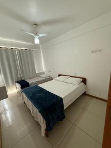 Ένα ή περισσότερα κρεβάτια σε δωμάτιο στο Apartamento com vista da Baía do Pontal