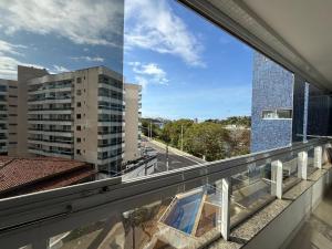 a view from the balcony of a building at Apartamento com vista da Baía do Pontal in Ilhéus