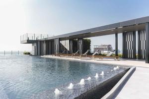 a rendering of a building with a pool of water at The Base 88-67 F5 in Pattaya
