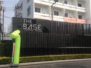 a black fence with a green sign in front of a building at The Base 88-67 F5 in Pattaya