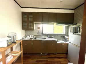 Kuchyň nebo kuchyňský kout v ubytování オーシャン日南らくだの宿 + 19 fotografií