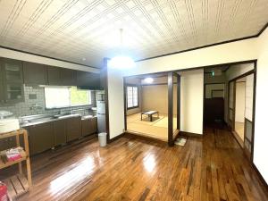 Kuchyň nebo kuchyňský kout v ubytování オーシャン日南らくだの宿