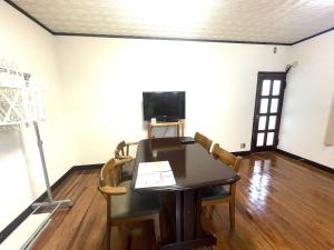 TV a/nebo společenská místnost v ubytování オーシャン日南らくだの宿