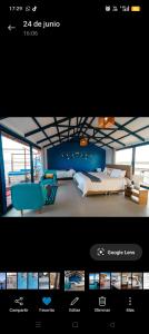 普诺Titicaca Lodge uros的一张卧室的照片,卧室里有一张床和一个网站