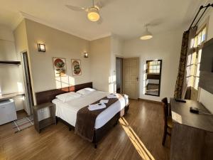 En eller flere senge i et værelse på Imperial Cidade Smart Suítes